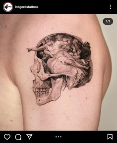 a man's shoulder with a skull and an angel on it, in black and white