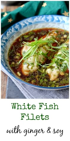 white fish fillets with ginger and soy in a blue bowl on a wooden table