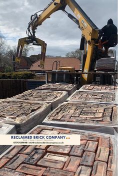 the back end of a construction vehicle with bricks stacked on it