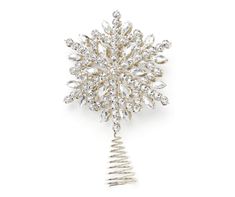 a gold and crystal snowflake brooch on a white background with clippings