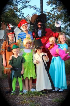 a group of children dressed up in costumes