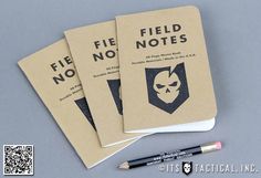 three notebooks with the words field notes written on them and a pencil next to it