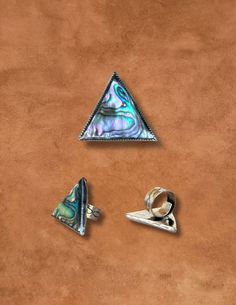 We are so honored to work with Diné artist Mary Jane Garcia. Mary Jane is Tl’og’i (Zia People) and Kinyaa’áanii (Towering House People) Clan and lives here in New Mexico. We love combining traditional design with a sleek modern perspective. This stunning Abalone gems are set in sterling silver, in radiant shades sunlight. Exquisitely crafted by Mary Jane in sterling silver, with hand stamped infinity design. Dimensions: 1-1/2” X 1-1/2" X 1-1/2" Ring Shank: 3/8” Abalone Ring, Native Designs, Turtle Island, Infinity Design, Native Design, Ring Shank, Curated Vintage, Vintage Gifts, Traditional Design