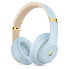 the beats on - ear headphones are light blue and have gold trimmings