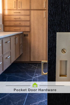 a door handle on the side of a wooden cabinet next to a kitchen counter top