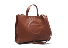 Buy and sell StockX Verified handbags on StockX including the Telfar Shopping Bag Medium Tan and thousands of other handbags with resale price data. Ugg And Telfar Tote Bag, Grey Telfar X Ugg Bag, Telfar Handbag, Telfar Shopping Bag, Telfar Bag, Harrods London, Authentic Bags, Be Aware, Brown Bags