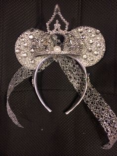 a tiara with pearls and beads on it's headbands is shown