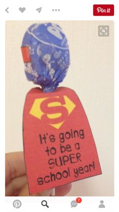 someone is holding up an ornament to say it's going to be a super school year