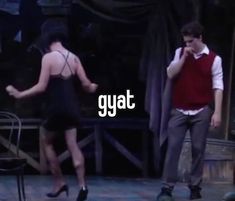 a man and woman standing on stage with the words gayat in front of them