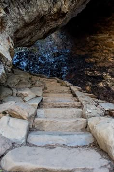 stone steps lead up to a cave entrance