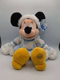 a mickey mouse stuffed animal sitting on top of a table