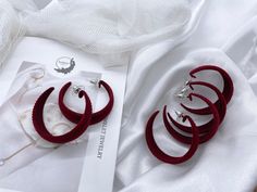 Would you like to try on something new for this Holiday Season look? How about velvet earrings in burgundy color? It will perfectly match with red wine in crystal glass and with your holiday season dress - your Christmas postcard will be not just cozy and warm, but elegant and stunning! Material: velvet, sterling silver. Length: 1.5 inch. - Avoid applying lotions or perfume once your jewelry are on. - Store earrings separately in fabric bags. We want you to love this product as much as we do. If you have any questions or concerns, please don't hesitate to contact us! Elegant Winter Earrings For Party, Burgundy Earrings For Party, Velvet Earrings, Oxblood Color, Pomegranate Earrings, Color Earrings, Costume Earrings, Back Jewelry, Wedding Jewelry Earrings