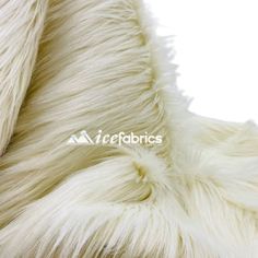 the back side of a white sheepskin coat with long, shaggy fur on it