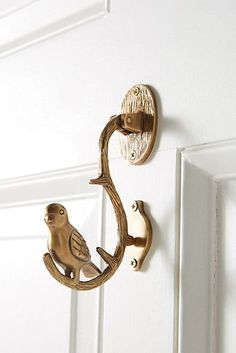 a door handle with a bird on it