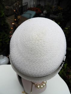 "LOVELY Classy Vtg 1940's Ladies White & Black Velvet Ribbon Woven Veiled Bumper Hat sz 21\" Diameter This is such a fun vintage Bumper hat from the 1940's. It's in just impeccable condition with no flaws I could note what so ever. The hat is a bright white woven fabric which feel synthetic to me. It has a short little brim which tilts up slightly at the sides with a gorgeous black veil attached to the front of the hat. There's a beautiful black velvet ribbon round the crown of the hat with Vintage Fitted Boater Hat With Curved Brim, Fitted Vintage Boater Hat With Curved Brim, Fitted Vintage Brimmed Boater Hat, Fitted Vintage Boater Hat With Short Brim, Fitted Vintage Boater Hat With Brim, Vintage Fitted Boater Hat With Short Brim, Fitted Retro Cream Hat, Retro Fitted Cream Hat, Retro Cream Hat