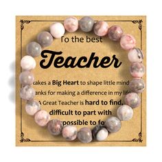 a teacher bracelet with the words to the best teacher on it and pink marble beads