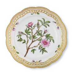 a white and gold plate with pink flowers on the rim, decorated with golden trimmings