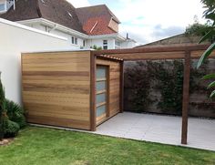 a wooden structure in the middle of a yard