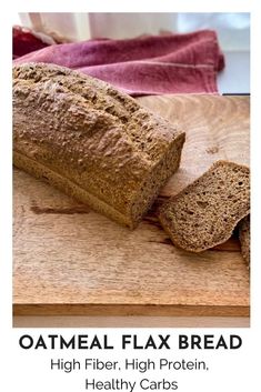 a loaf of oatmeal flax bread sitting on top of a cutting board