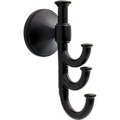 a black candle holder with three candles on it's side and an attached hook