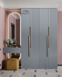 a room with pink walls and gold handles on the doors is decorated in pastel colors