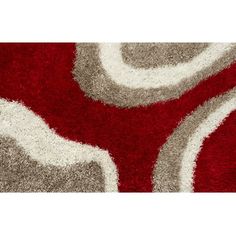 a red and grey rug with white circles on it