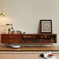 a living room scene with focus on the coffee table and sideboard in the foreground