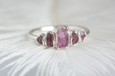 999 Pure Fine Silver Rough Pink Sapphire Gemstone Stacking Ring // Pink Sapphire Ring // Pink Gemstone Ring // Stackable Gemstone Rings // Gift This listing is for one raw pink Sapphire ring. No copper, no nickel, allergy free. Suitable for people with sensitive skin. DETAILS: Stone: natural pink raw Sapphire (heated) Stone size: centre stone approx. 6x4mm, smallest stones 3mm Metal: 925 silver base, electroformed in 999 silver and oxidized black or plated with 18k rose gold, 24k yellow gold or Pink Ruby Ring In Sterling Silver For Wedding, Pink Ruby Wedding Ring In Sterling Silver, Pink Stackable Ruby Ring, Pink Sterling Silver Stackable Rings For Wedding, Pink Stackable Crystal Promise Ring, Pink Sterling Silver Stackable Jewelry, Pink Sterling Silver Stackable Promise Rings, Stackable Pink Ruby Ring For Wedding, Pink Stackable Rings For Promise