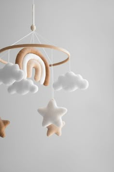 a mobile with stars and clouds hanging from it