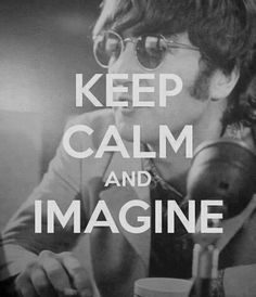 a man sitting at a table with a cup in his hand and the words keep calm and imagine on it