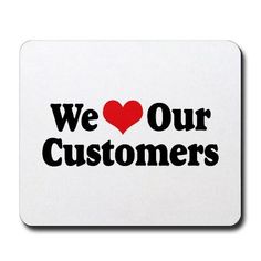 we love our customers sticker on a white mouse pad with the words, we love our customers