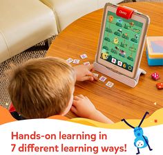 a young boy playing with an ipad on a table in front of him is the words hands - on learning in 7 different learning ways