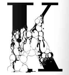 the letter k is made up of bubbles and water droplets in black and white colors