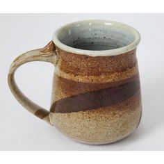 a brown and white striped coffee mug