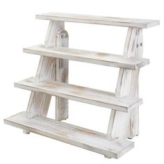 a white wooden shelf with three shelves on each side