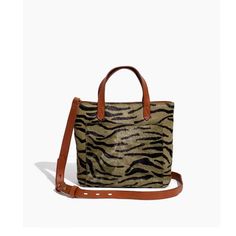 A small-but-roomy take on our best-selling Medium Transport Tote, now in cool leopard print. What goes into it? Carry with the top handles or the detachable shoulder strap. 1 exterior pocket for those things you gotta grab fast.Made of textural calf hair.
Please note: As it is made of a natural material, each bag varies slightly in texture and color.
Interior and exterior pockets.
3 1/2" handle drop.
19" (at shortest) to 21 5/8" (at longest) crossbody drop.7 3/4"H x 7 3/4"W x 2 5 /8"D. Calf Hair Handbags, Fab Five, Bags And Purses, Purses For Women, Denim Shoes, Women's Handbags, Calf Hair, Small Crossbody, Bags Purses