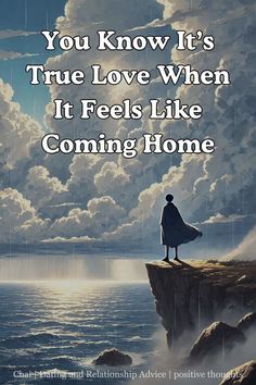 a person standing on the edge of a cliff with clouds in the background and text that reads, you know it's true love when it feels like coming home