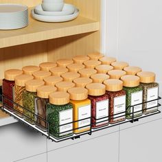 the spice rack is full of spices and seasonings in it's drawer area