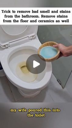 someone is removing the toilet from its tank