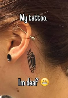 a girl with a tattoo on her ear saying, i'm dear my tattoo