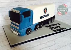 a cake shaped like a truck with the name scana on it's side