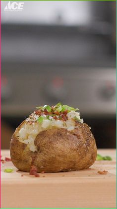 a baked potato sitting on top of a cutting board