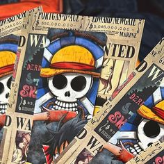 three newspapers with cartoon characters on them and one has a pirate skull in the middle