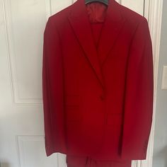 Comes With The Jacket, Red Vest, And Pants Red Fitted Outerwear For Business, Red Fitted Outerwear For Formal Occasions, Red Fitted Formal Outerwear, Fitted Red Formal Outerwear, Formal Red Suit For Fall, Red Notch Lapel Outerwear For Formal Occasions, Classic Red Suits For Workwear, Red Notch Lapel Business Outerwear, Red Notch Lapel Suits For Fall