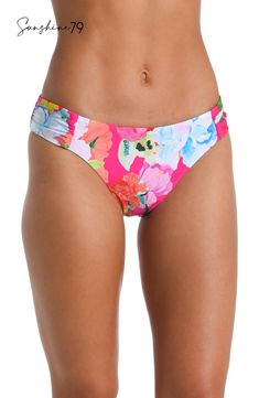 Drenched in vibrant energy, this hipster bottom by Sunshine 79 features a bold hot pink floral print that radiates an atmosphere of tropical exuberance. The vivid and lively floral pattern adds a pop of color and a sense of playful charm to your swimwear collection. At once sexy and sophisticated, these hipsters feature a high-cut front with hip-flattering shirring on each side. Just-right coverage in back keeps the look subtly seductive. [split] Details Hipster bikini bottom Hip-flattering side Vibrant Fitted Poolside Bottoms, Vibrant Fitted Bottoms For Poolside, Floral Print Stretch Bottoms For Pool, Multicolor Floral Print Beachwear Bottoms, Vibrant Swimwear With Bold Print, Stretch Floral Print Bottoms For Pool, Multicolor Floral Print Bottoms For Beachwear, Beachwear Multicolor Floral Print Bottoms, Tropical Stretch Bottoms With Floral Print