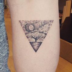 a small triangle tattoo with a tree and moon in the sky on the right arm