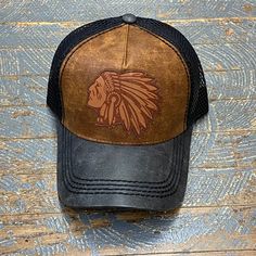 Indian Head Leather Patch Tan Leather Trucker Ball Cap Adjustable Brown Rugged Hat, Adjustable Rugged Brown Hat, Adjustable Brown Leather Baseball Cap, Vintage Distressed Trucker Hat, Vintage Adjustable Trucker Hat For Baseball Season, Vintage Adjustable Hat In Faded Color, Vintage Brown Baseball Cap, Vintage Adjustable Faded Hat, Retro Distressed Adjustable Hats