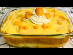 a casserole dish with oranges and whipped cream