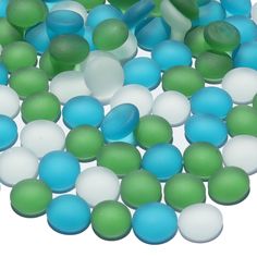 green, white and blue candies are scattered together