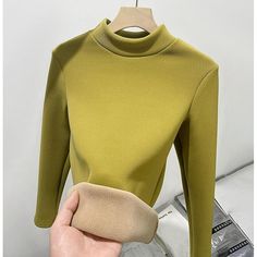 Category:T-shirt; Season:Fall,Winter; Fabric:Polyester; Sleeve Length:Long Sleeve; Look After Me:Machine wash; Gender:Women's; Style:Casual; Elasticity:Micro-elastic; Tops Type:Tunic; Occasion:Daily; Details:Fleece lined; Top Length:Regular Tops; Fit Type:Regular Fit; Pattern:Solid Color; Neckline:Turtleneck; Listing Date:09/30/2024 High Stretch Solid Color Fall Tops, Trendy Plain Winter Tops, Winter Stretch Tops In Solid Color, Green Solid Color Top For Winter, Green Solid Color Winter Top, Fitted Plain Tops For Winter, Khaki Long Sleeve Winter Tops, Khaki Long Sleeve Tops For Winter, Green Non-stretch Tops For Winter